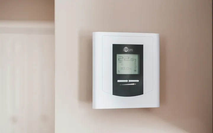 Home heating thermostat on a wall