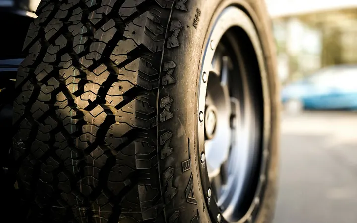 Close-up of a car tire and alloy wheel